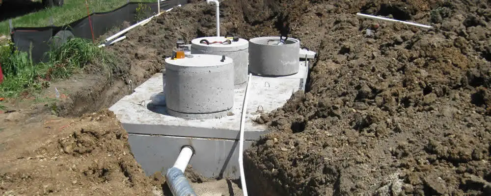 Septic system repair and installation site with tank access ports in Seattle, WA