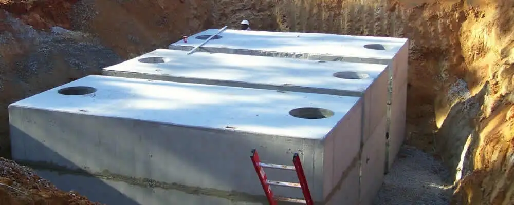 Septic tank installation site with a newly placed concrete tank in Seattle, WA